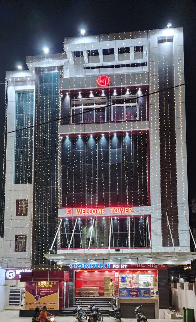 Welcome Tower building exterior at night in Gaya